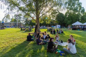 Multiple students sitting on the quad during rockypalooza
