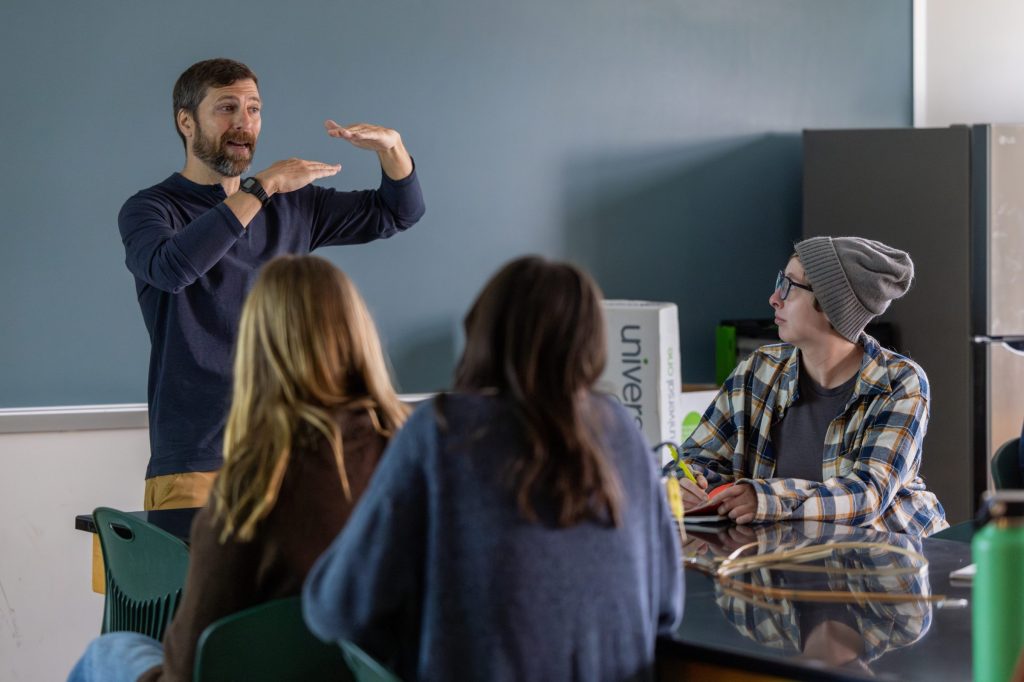 Teacher instructing students in classroom